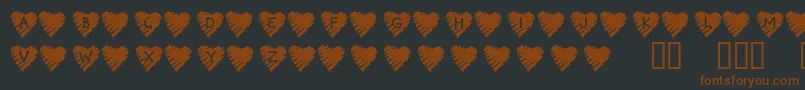 フォントKrScribbleHeart – 黒い背景に茶色のフォント