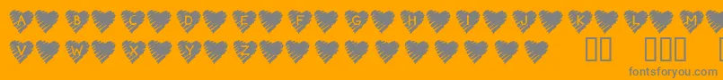Fonte KrScribbleHeart – fontes cinzas em um fundo laranja