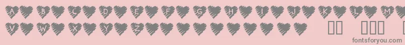 KrScribbleHeart-fontti – harmaat kirjasimet vaaleanpunaisella taustalla