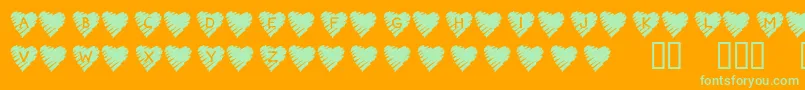 KrScribbleHeart-Schriftart – Grüne Schriften auf orangefarbenem Hintergrund
