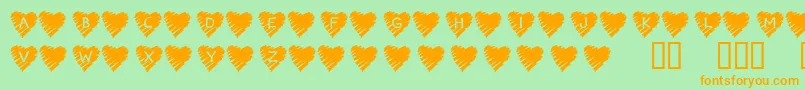 KrScribbleHeart-fontti – oranssit fontit vihreällä taustalla