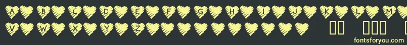 KrScribbleHeart-Schriftart – Gelbe Schriften auf schwarzem Hintergrund