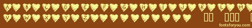 KrScribbleHeart-fontti – keltaiset fontit ruskealla taustalla