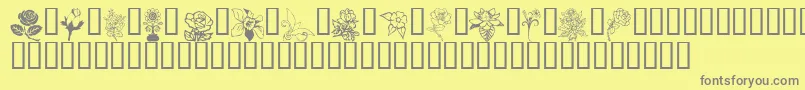 FloralDesign-fontti – harmaat kirjasimet keltaisella taustalla