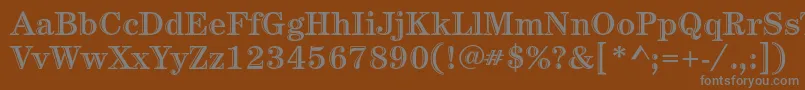 CenturystdHandtooledbold-fontti – harmaat kirjasimet ruskealla taustalla
