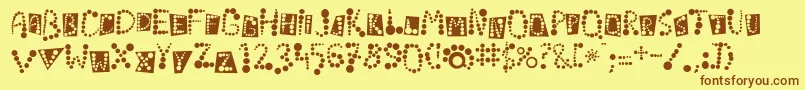 フォントLinotypekropki – 茶色の文字が黄色の背景にあります。