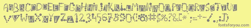 Linotypekropki-fontti – harmaat kirjasimet keltaisella taustalla