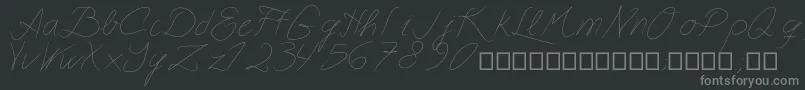 Astralasia-fontti – harmaat kirjasimet mustalla taustalla