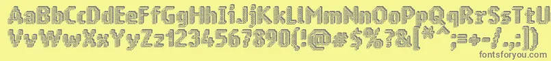 Ringmatrix3D-fontti – harmaat kirjasimet keltaisella taustalla