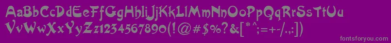 Artistik-fontti – harmaat kirjasimet violetilla taustalla
