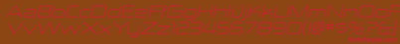 フォントZektonexltItalic – 赤い文字が茶色の背景にあります。