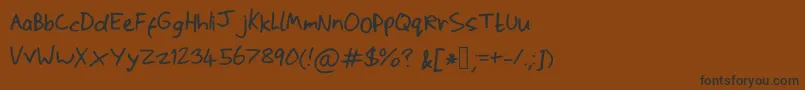 Scrawlywawly Font – Black Fonts on Brown Background