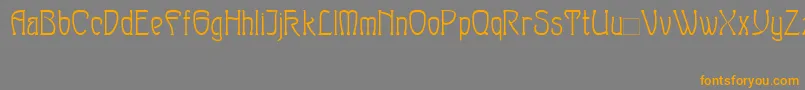 フォントSylph – オレンジの文字は灰色の背景にあります。