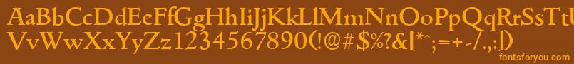 フォントGouditaserialMediumRegular – オレンジ色の文字が茶色の背景にあります。