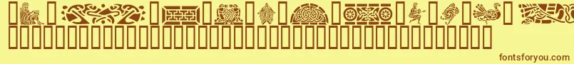 フォントGeCelticArt – 茶色の文字が黄色の背景にあります。