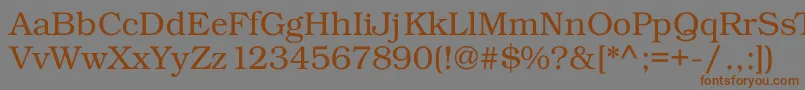 フォントKacsttitle – 茶色の文字が灰色の背景にあります。