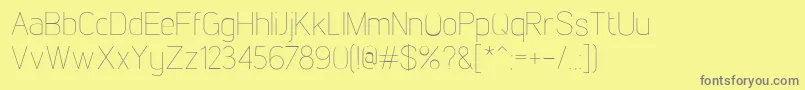 LintelThin-fontti – harmaat kirjasimet keltaisella taustalla