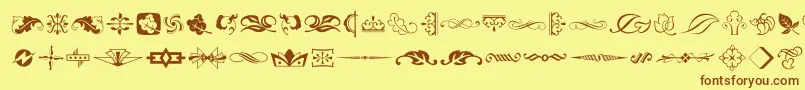 フォントTypeEmbellishmentsTwoLetPlain.1.0 – 茶色の文字が黄色の背景にあります。