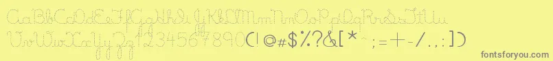 LumenDots-fontti – harmaat kirjasimet keltaisella taustalla