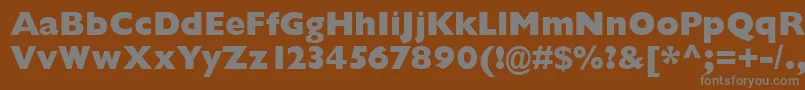 GarrisonExtraboldSansBold-fontti – harmaat kirjasimet ruskealla taustalla