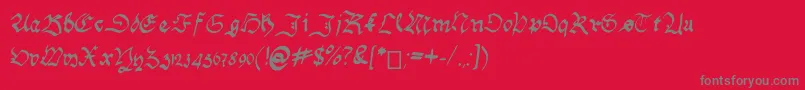 Fonte HandwritingSchwabacher – fontes cinzas em um fundo vermelho