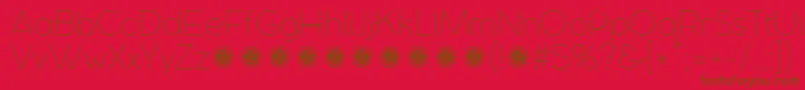 CocomatUltralightTrial-Schriftart – Braune Schriften auf rotem Hintergrund