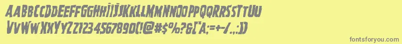 フォントGhoulishintentmangleital – 黄色の背景に灰色の文字