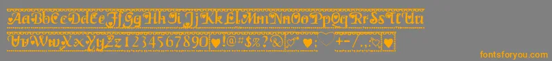 フォントValentine1 – オレンジの文字は灰色の背景にあります。