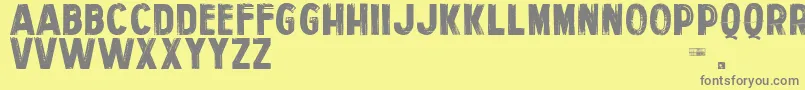 フォントPersonalServices – 黄色の背景に灰色の文字