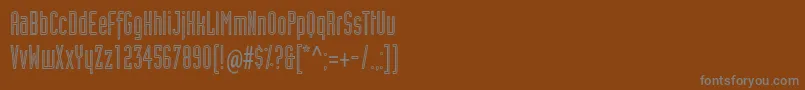 フォントIndustrialtstdInline – 茶色の背景に灰色の文字