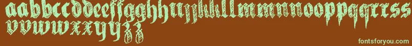 フォントLaFraktouille – 緑色の文字が茶色の背景にあります。