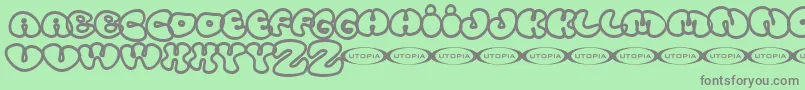 フォントTolo – 緑の背景に灰色の文字