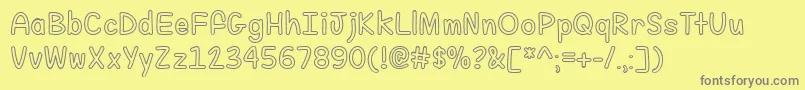 FillMeWithColor-Schriftart – Graue Schriften auf gelbem Hintergrund