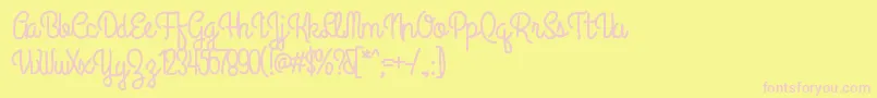 Anipetitehotel-Schriftart – Rosa Schriften auf gelbem Hintergrund