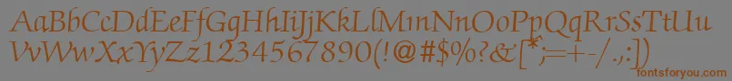 フォントZabriskiescriptRegularDb – 茶色の文字が灰色の背景にあります。