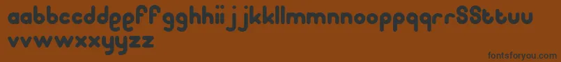 Pooplatter Font – Black Fonts on Brown Background