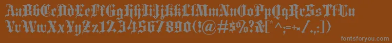 Więcej informacji o czcionce Blackletter Czcionka Blackletter – szare czcionki na brązowym tle