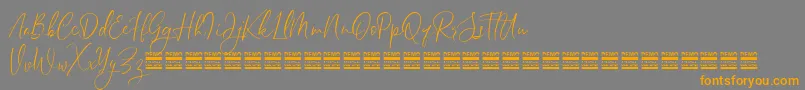 SheilazainDemo-Schriftart – Orangefarbene Schriften auf grauem Hintergrund