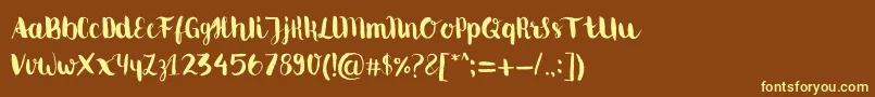 Movusbrushpen-fontti – keltaiset fontit ruskealla taustalla