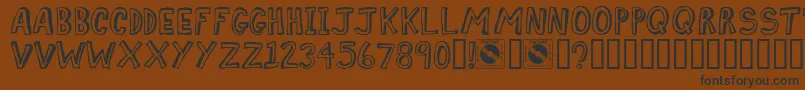 Comiz Font – Black Fonts on Brown Background