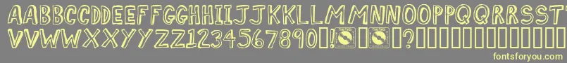 Comiz Font – Yellow Fonts on Gray Background