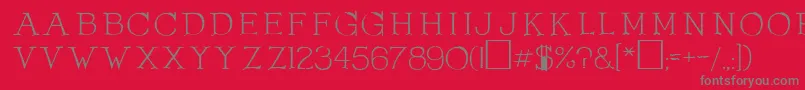 フォントOlduvaiRegular – 赤い背景に灰色の文字