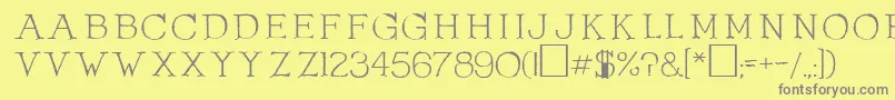 OlduvaiRegular-fontti – harmaat kirjasimet keltaisella taustalla
