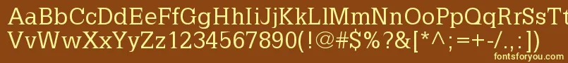 LatiniaNormal-fontti – keltaiset fontit ruskealla taustalla