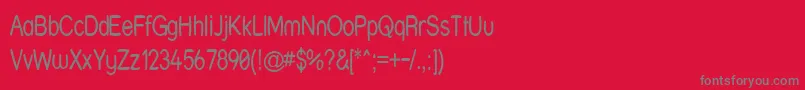 Strwrn-fontti – harmaat kirjasimet punaisella taustalla