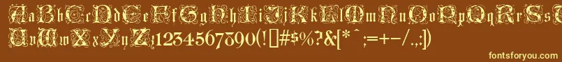 LombardinaInitialOne-fontti – keltaiset fontit ruskealla taustalla