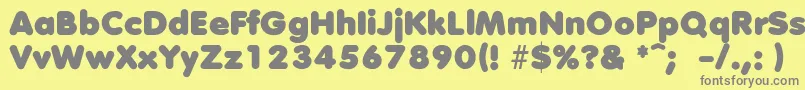フォントDebussyLengyar – 黄色の背景に灰色の文字