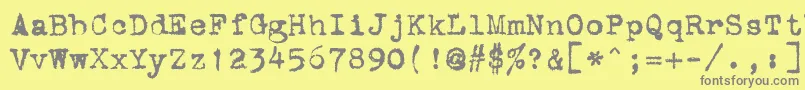 StOldTypewriter-fontti – harmaat kirjasimet keltaisella taustalla