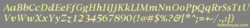 AvdiraBoldItalic-fontti – keltaiset fontit harmaalla taustalla