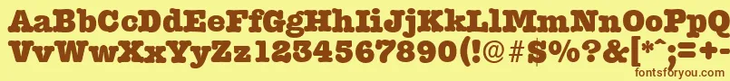 Fonte TypewriterserialHeavyRegular – fontes marrons em um fundo amarelo